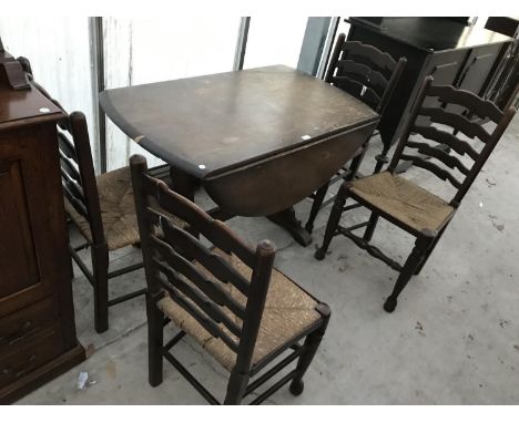 AN OAK DROP LEAF DINING TABLE AND FOUR OAK LADDER BACK DINING CHAIRS WITH RUSH SEATS 