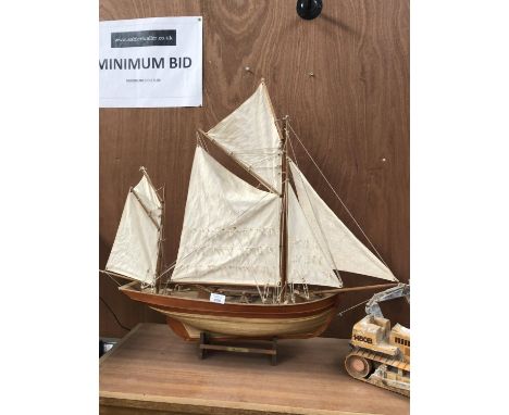 A LARGE WOODEN HAND MADE SAILING BOAT MODEL 