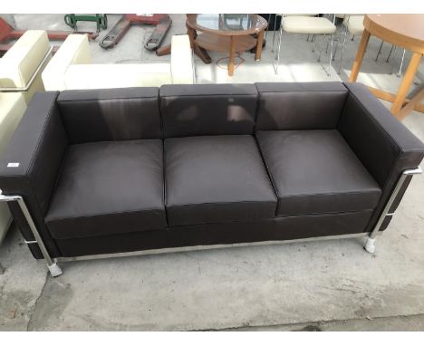 A MODERN BROWN LEATHER THREE SEATER SOFA ON TUBULAR CHROME SUPPORTS 180 CM X 78 CM X 67 CM HIGH 