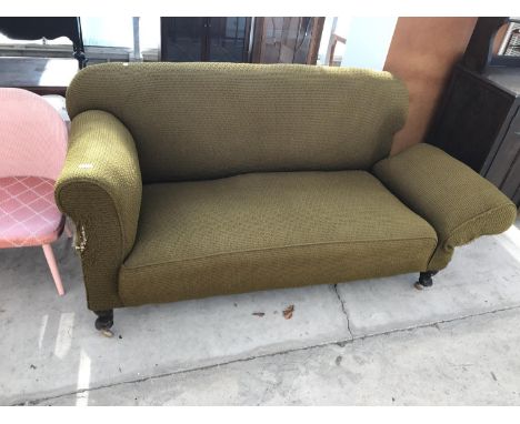 A VINTAGE DROP ARM SOFA 