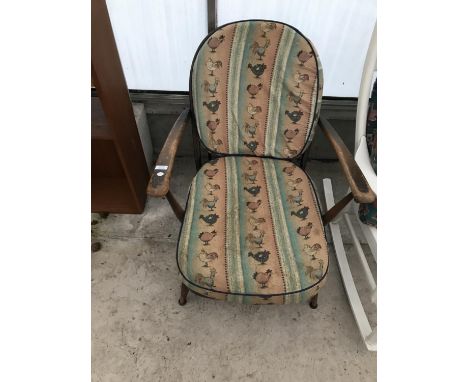 AN ERCOL ELM ARMCHAIR 