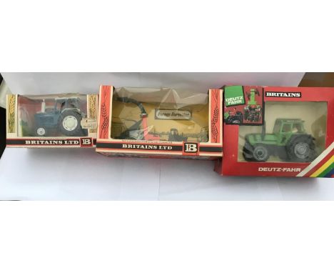 THREE BOXED BRITAINS FARMYARD  ITEMS - A FORD 6600 TRACTOR, A FORAGE HARVESTER AND A DEUTZ FAHR DX92 TRACTOR 