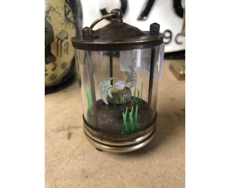 A MINIATURE CASED FISH TIMER 