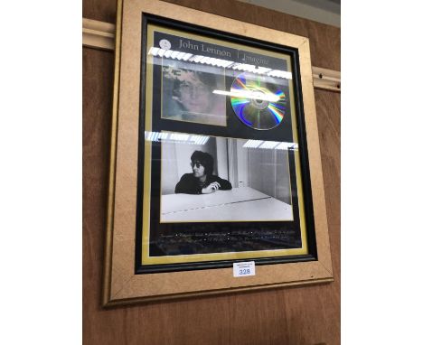 A 'JOHN LENNON' FRAMED IMAGINE CD 