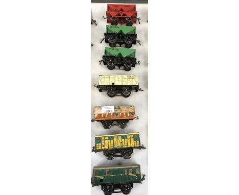SEVEN ASSORTED VINTAGE TINPLATE MODEL RAILWAY CARRIAGES 