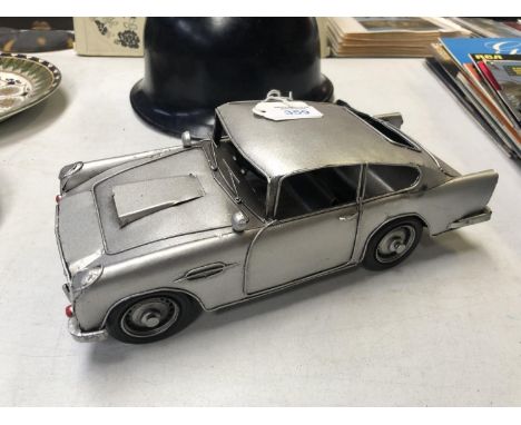 A TINPLATE MODEL OF AN ASTON MARTIN CAR 