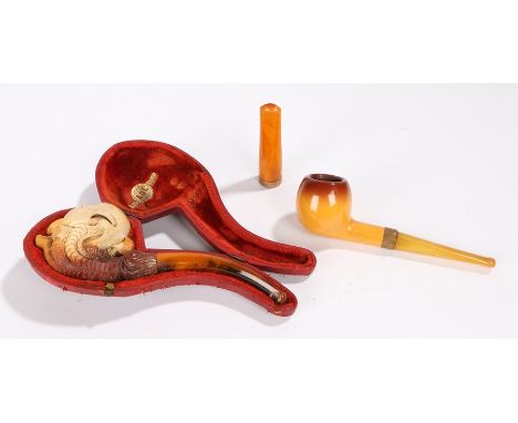 Meerschaum pipe, carved as an eagle claw and bowl, 17cm long, cased, together with a Baronite pipe and an amber and 9 carat g