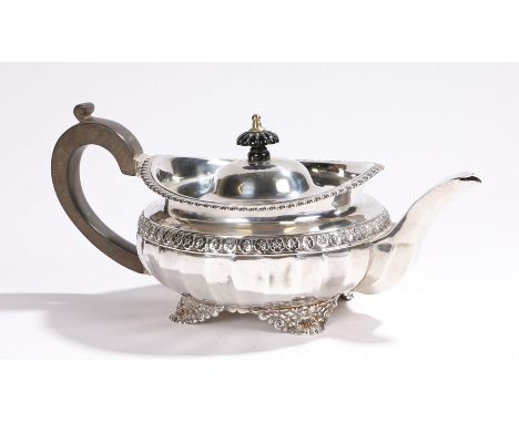 George IV silver teapot, London 1824, makers marks rubbed, with gadrooned finial and scroll handle, with gadrooned rim and bo