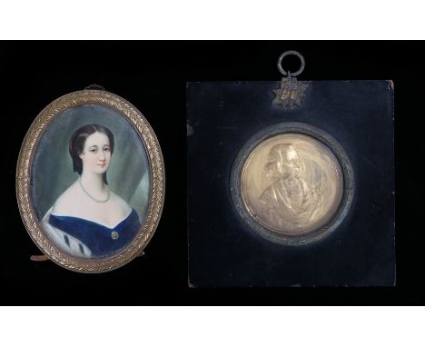 19th Century miniature portrait, of a lady in a blue dress, 6.5cm wide, together with a gilt metal medallion of Reverend Wesl