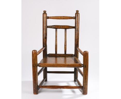 19th Century child's turned chair, with ring turned spindle back above a solid seat and low arms above the turned legs, 65cm 