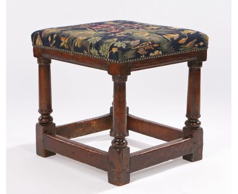 17th Century oak stool, the later tapestry seat above turned columns united by stretchers, 42cm wide x 45cm high