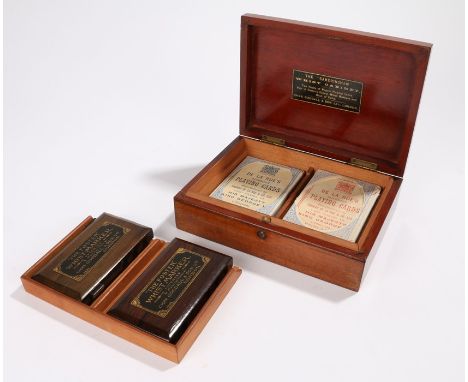 The "Sandringham" whist cabinet by Chas. Goodall &amp; Son Ltd London, containing two "The Foster" whist markers, two packs o