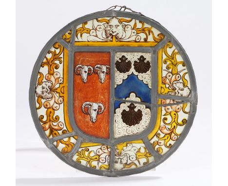 19th Century stained glass panel, the central shield shaped panel with heraldic crest depicting three ram's heads and three s