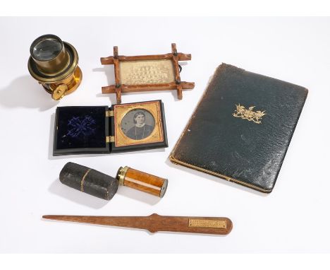 Works of art, to include a cased ambrotype, an eye glass, a lens, a frame a letter opener from the flag ship at Jutland and L