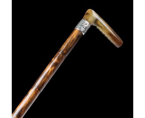 Victorian walking stick, possibly rhinoceros horn handle, the scroll decorated silver band engraved  H. King, Birmingham 1898