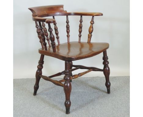 A Victorian carved rosewood and blue upholstered button back armchair, on cabriole legs