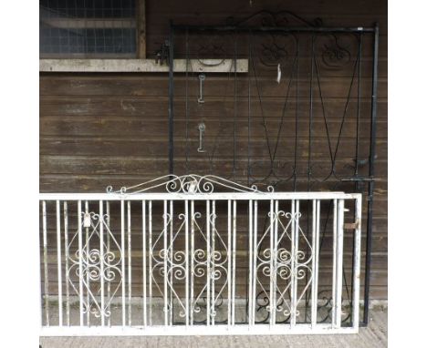 A pair of white painted iron gates, 254cm overall, together with a black iron gate