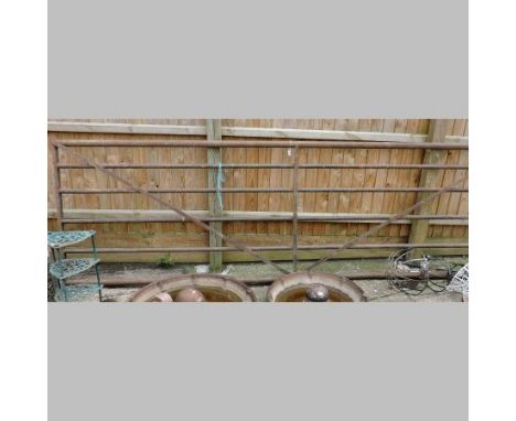 A green painted metal six bar stock gate, 370cm