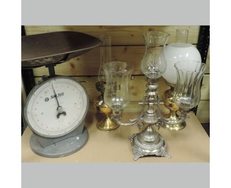 A brass oil lamp, together with another, a candelabra and a set of Salter scales, 45cm tall