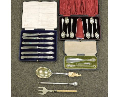 A set of six silver teaspoons, cased, together with a set of tea knives, cased, a button set and plated items