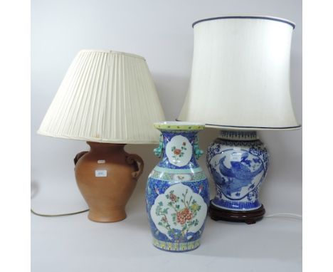 A Chinese porcelain blue and white lamp and shade, together with a terracotta lamp and a Chinese vase, 38cm tall