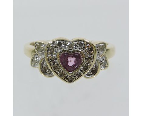 A 9 carat gold ruby and diamond heart shaped ring