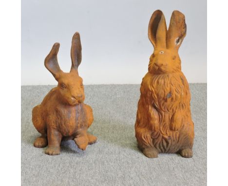 A cast iron model of a rabbit, together with another, largest 43cm tall
