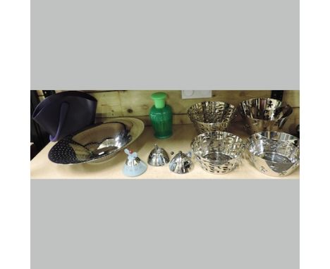 An Alessi chromed sugar bowl, spoon and milk jug, stamped Inox 18/10, together with an Alessi pierced oval fruit dish, 44cm, 