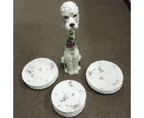 A collection of Limoges plates, together with a large pottery model of a poodle, 57cm tall
