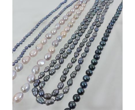 A collection of three freshwater grey pearl necklaces, together with a pink pearl necklace
