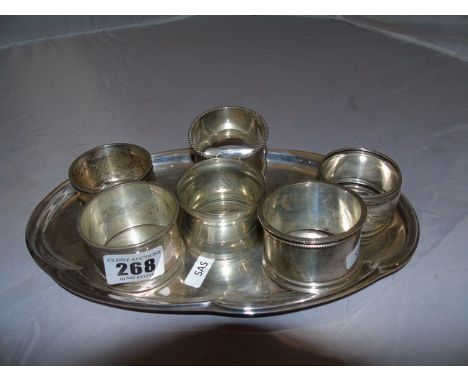 TRAY LOT OF SILVER NAPKIN RINGS DUTCH SWORD MARK ON 5 &amp; I PLATED EST[£25-£50]