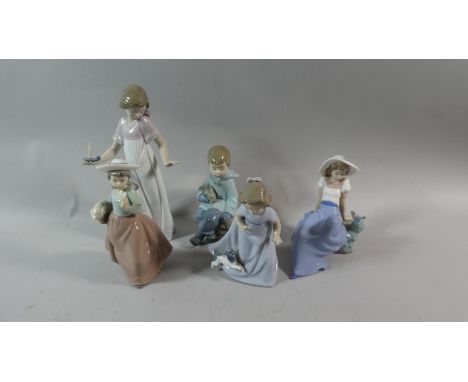 A Collection Five Nao Figural Ornaments 