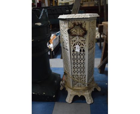 A Cast Metal Cathedral Heater with Converted Oil Lamp Illumination, 70cm High 