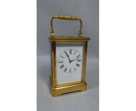 A French Brass Carriage Clock, the Base Plate no.17649, 17cm High with Handle Raised 