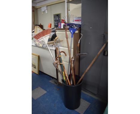A Bucket Containing Various Garden Tools, Walking Sticks and Umbrellas 