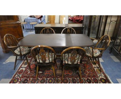 An Ercol Dining Suite Comprising Refectory Style Dining Table, Six Fleur De Lys Hoop Back Dining Chairs and a Side Board with