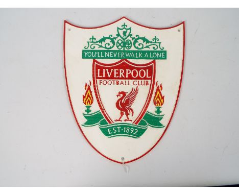 A cast iron wall plaque marked Liverpool Football Club, 33 cm x 27 cm, appears in good condition (this does not constitute a 