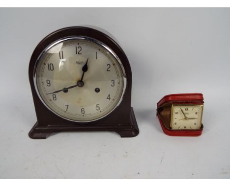 Smiths - A Bakelite mantel clock by Smiths, Enfield. The arched case with circular silvered dial, black Arabic numerals, with