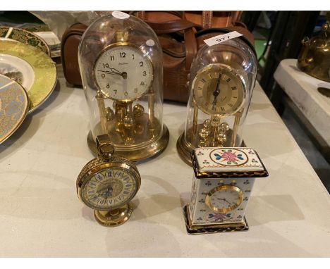 FOUR CLOCKS TO INCLUDE A CASED BENTIMA ANNIVERSARY CLOCK, A BRASS ESTYMA CLOCK, A SMALL CERAMIC MANTEL CLOCK ETC. 