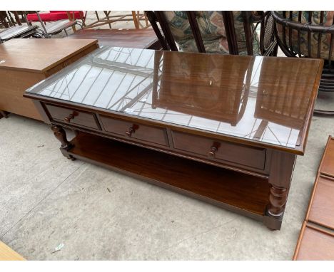 A MAHOGANY COFFEE TABLE WITH THREE DRAWERS, LOWER SHELF AND GLASS TOP 