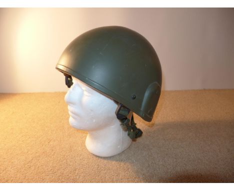 A BRITISH ARMY TANK CREW HELMET DATED 1986 