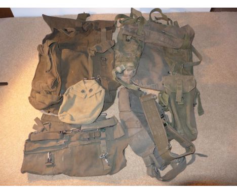 A COLLECTION OF ARMY WEBBING TO INCLUDE WATER BOTTLE COVER, AMMUNITION POUCHES ETC 