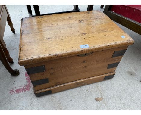 A SMALL PINE TWO HANDLED TRUNK WITH METAL STRAPS, 20.5x14" 