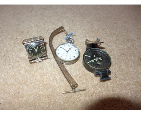 A MILITARY G.S.T.P. WATCH, COMPASS AND A SMALL BEDSIDE CLOCK 