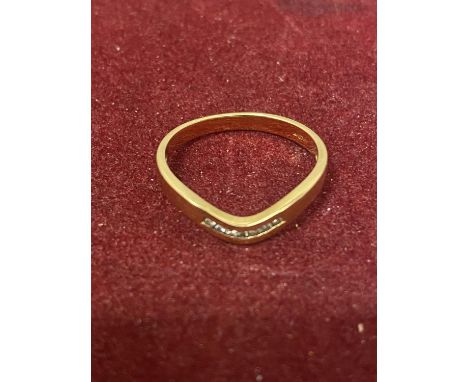 A 9 CARAT GOLD WISHBONE STYLE RING WITH SEVEN DIAMONDS 