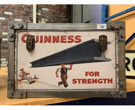 A TWIN HANDLED TRUNK DECORATED WITH 'GUINNESS' ADVERTISING MATERIAL 