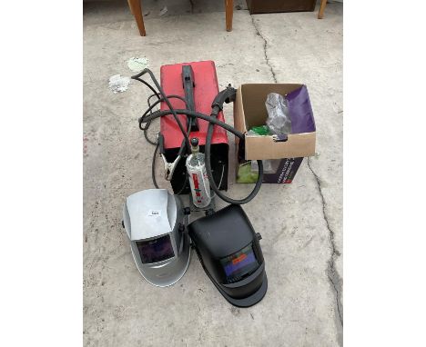 A WOLF WELD MIG WELDER AND TWO PARWELD LIGHT ACTIVATED WELDING MASKS (ONE AS NEW AND BOXED) 