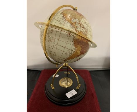 A GLOBE ON A WOODEN STAND TO INCLUDE A COMPASS WITHIN THE BASE HEIGHT 31CM 