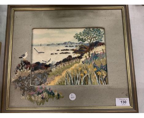 A FRAMED TAPESTRY OF A COASTAL SCENE 
