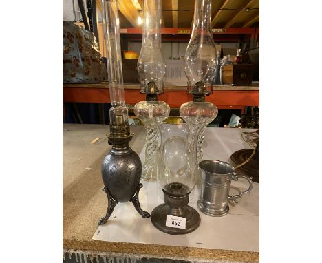 A PAIR OF GLASS BARLEY TWIST STYLE OL LAMPS, A DECORATIVE PEWTER OIL LAMP AND TANKARD ETC 